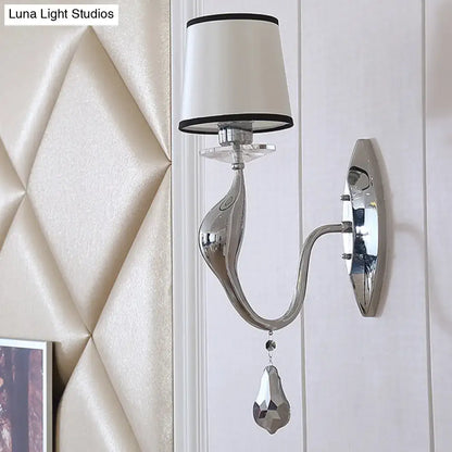 Modern chrome wall lamp with fabric shade and crystal – living room