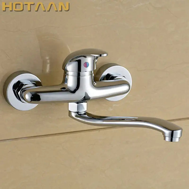 Modern chrome wall mounted kitchen tap with curved spout