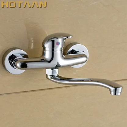 Modern chrome wall mounted kitchen tap with curved spout