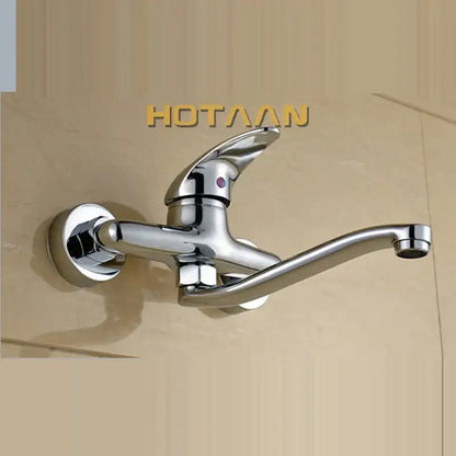 Modern chrome wall mounted kitchen tap with curved spout