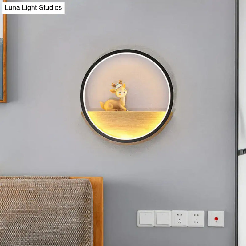 Modern circular black wall light with decorative deer living room
