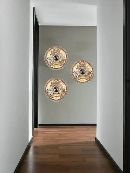 Modern circular swirling designer glass wall lamp for bedroom