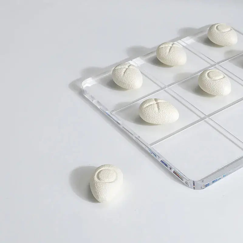 Modern clear acrylic tic tac toe board with resin pebble chess pieces living room decor