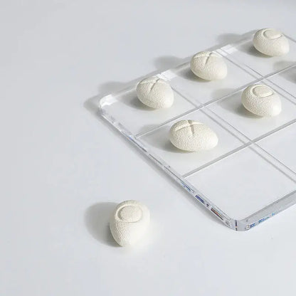 Modern clear acrylic tic tac toe board with resin pebble chess pieces living room decor