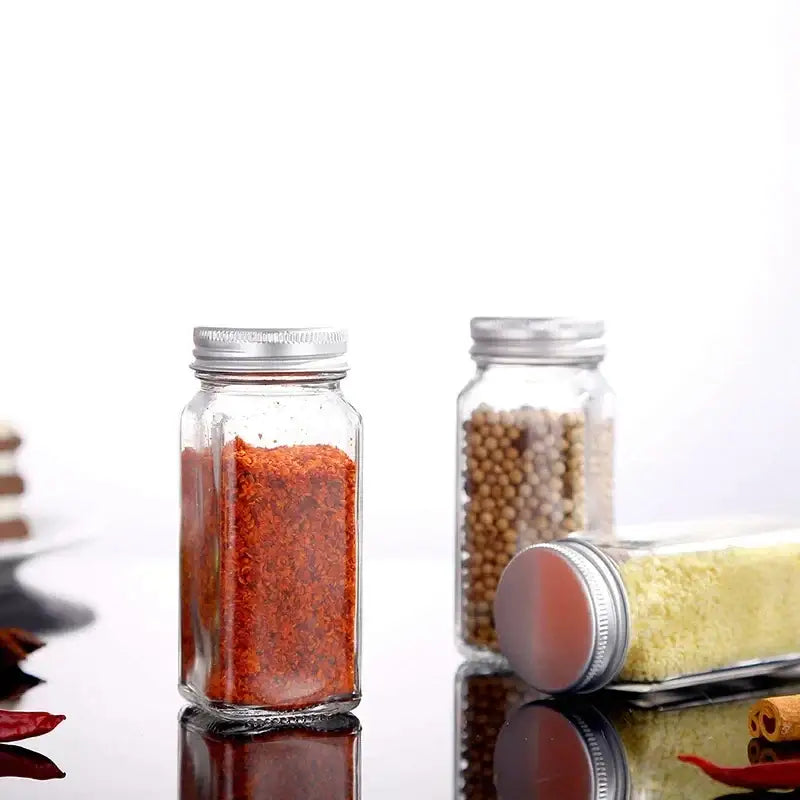 Modern clear glass seasoning jar set with black lids for kitchen
