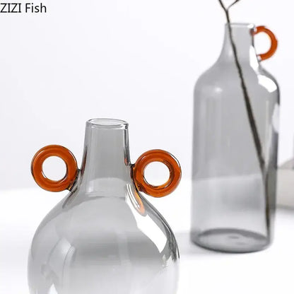Modern clear glass vase with orange handles living room decor