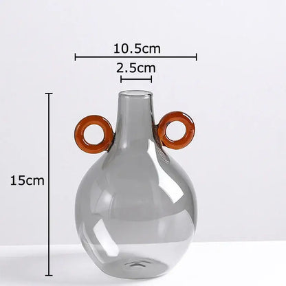 Modern clear glass vase with orange handles living room decor