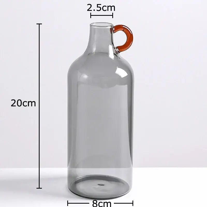 Modern clear glass vase with orange handles living room decor