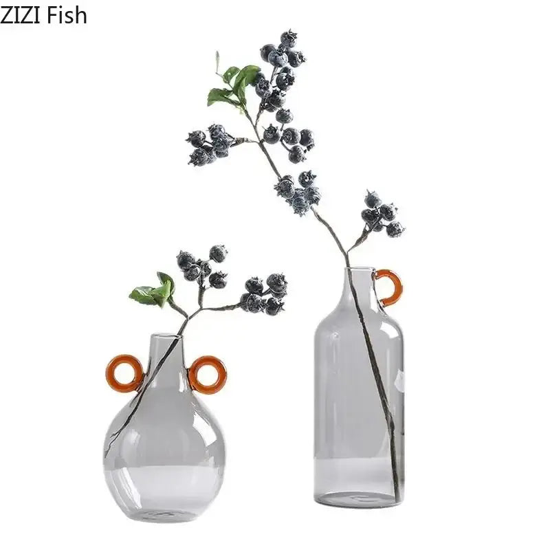 Modern clear glass vase with orange handles living room decor