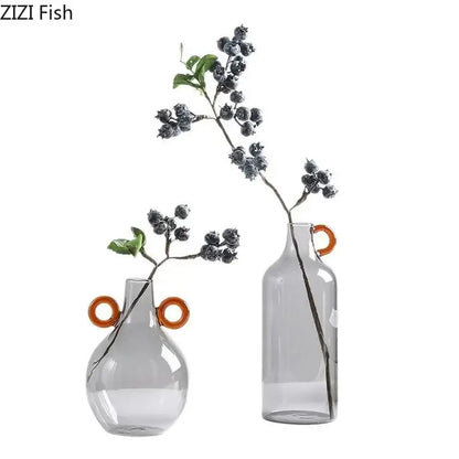 Modern clear glass vase with orange handles living room decor