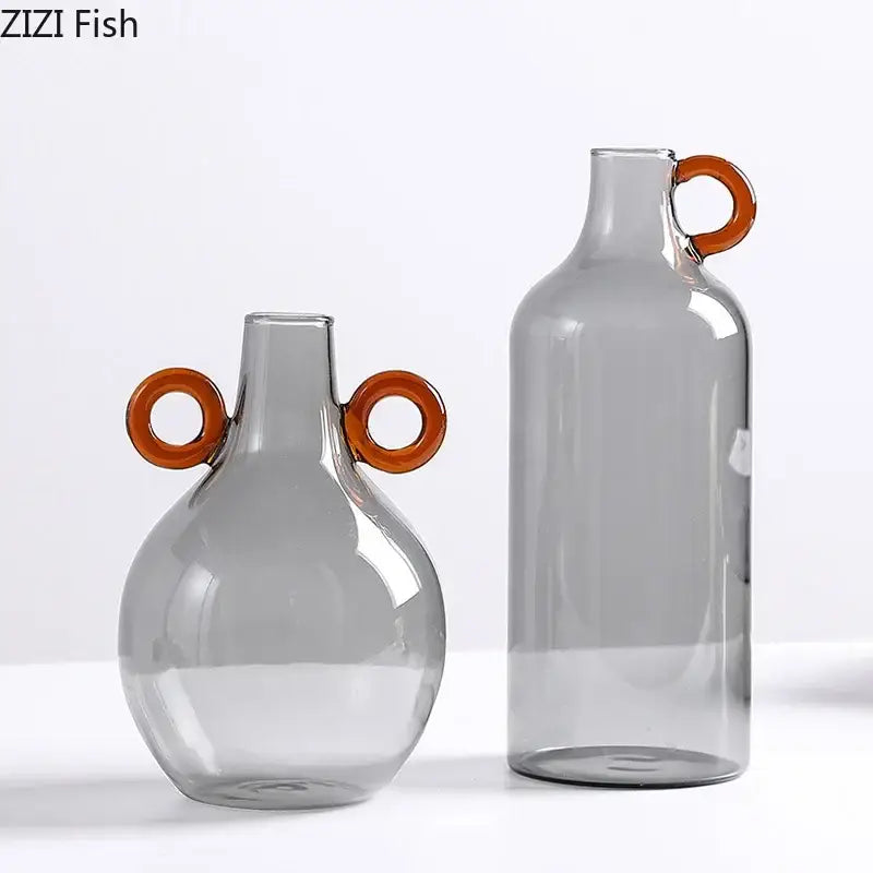 Modern clear glass vase with orange handles living room decor