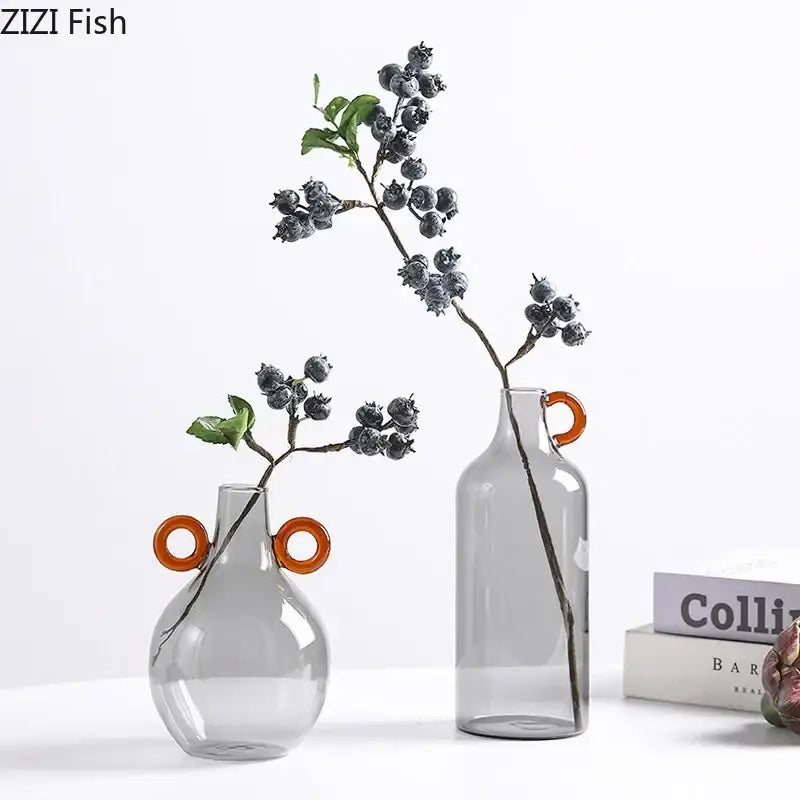 Modern clear glass vase with orange handles living room decor