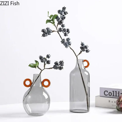 Modern clear glass vase with orange handles living room decor