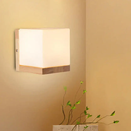 Modern cube shaped sconce wall lamp with wooden backplate bedroom light