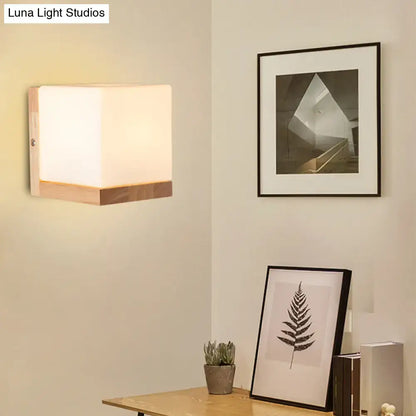 Modern cube shaped sconce wall lamp with wooden backplate bedroom light