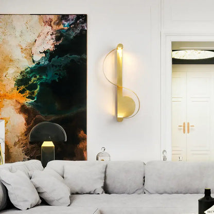 Modern curved gold wall sconce warm white light bedroom fixture