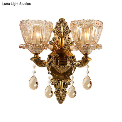 Modern floral brass wall sconce with teardrop crystal drop living room