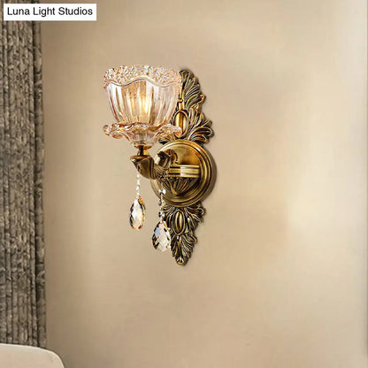Modern floral brass wall sconce with teardrop crystal drop living room