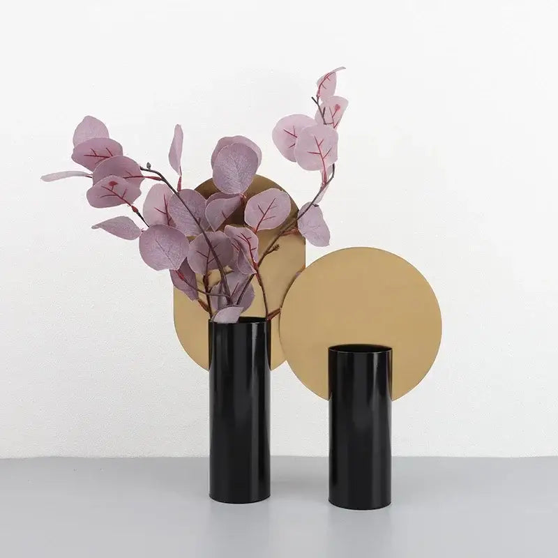 Modern geometric cylinder vase with pink artificial flowers living room