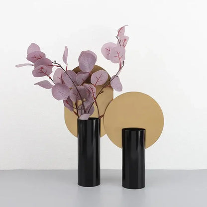 Modern geometric cylinder vase with pink artificial flowers living room