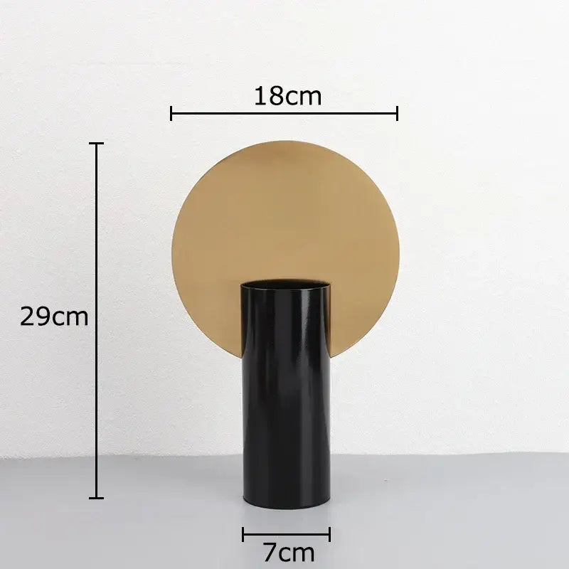 Modern geometric cylinder vase with pink artificial flowers living room
