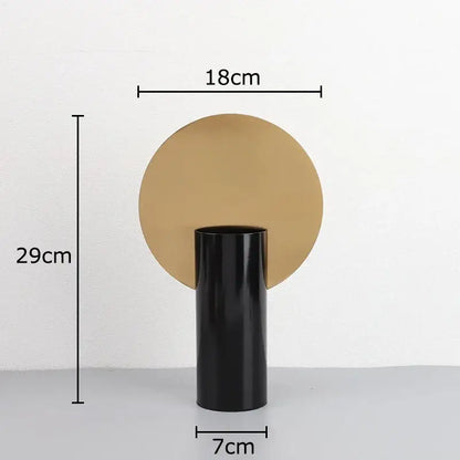Modern geometric cylinder vase with pink artificial flowers living room