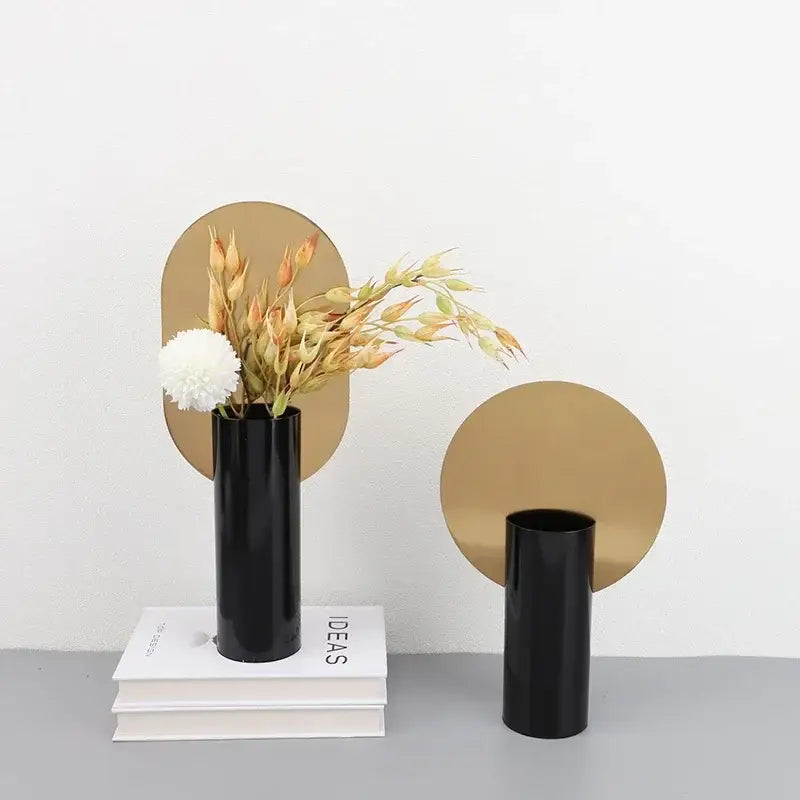 Modern geometric cylinder vase with pink artificial flowers living room