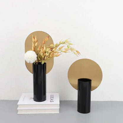 Modern geometric cylinder vase with pink artificial flowers living room