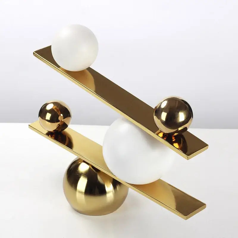 Modern geometric golden ball seesaw ramp living room sculpture