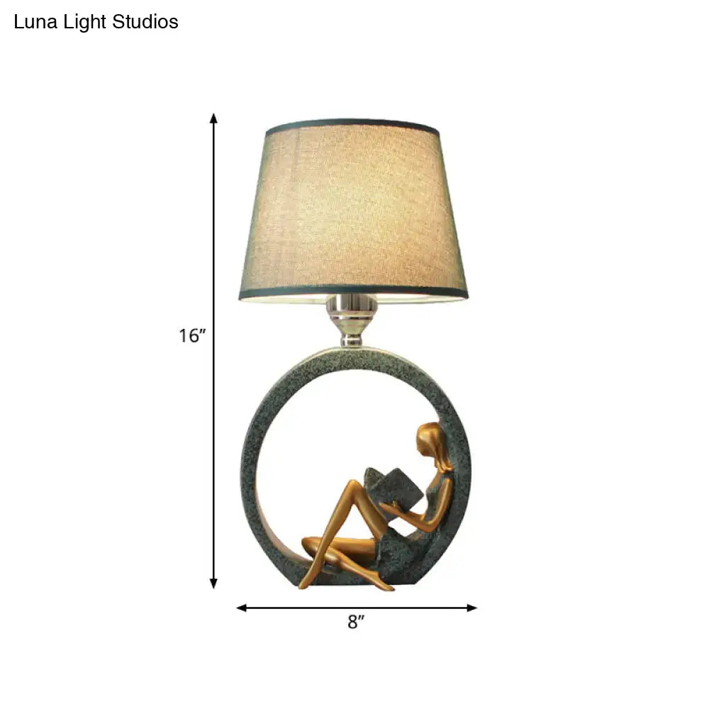 Modern girl reading teal resin night lamp with fabric shade bedroom