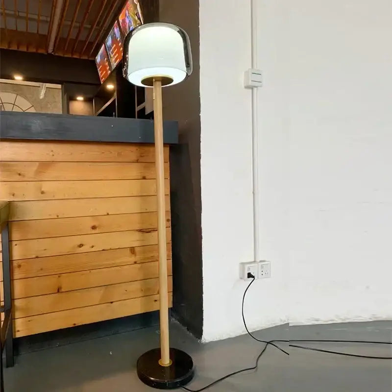 Modern glass floor lamp with wood pole for living room
