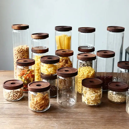 Modern glass hermetic storage jars with dark wood airtight lids kitchen
