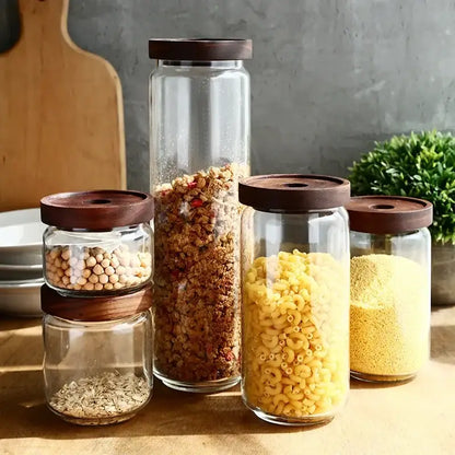 Modern glass hermetic storage jars with dark wood airtight lids kitchen