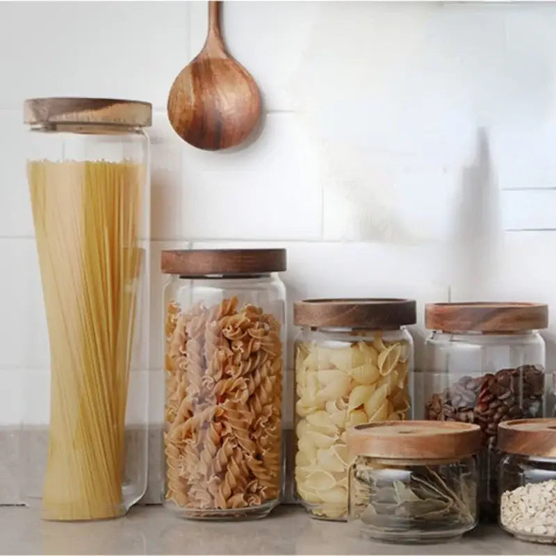 Modern glass hermetic storage jars with dark wood airtight lids kitchen