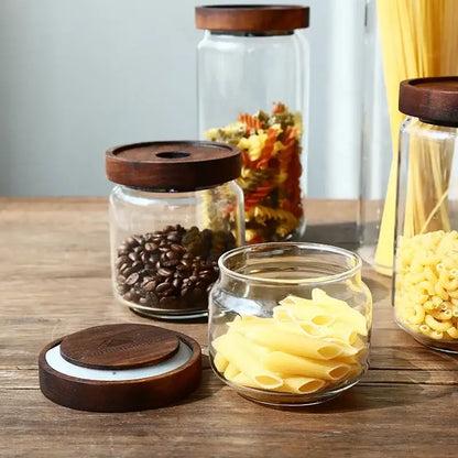 Modern glass hermetic storage jars with dark wood airtight lids kitchen
