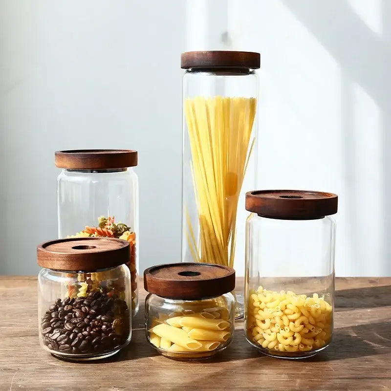 Modern glass hermetic storage jars with dark wood airtight lids kitchen