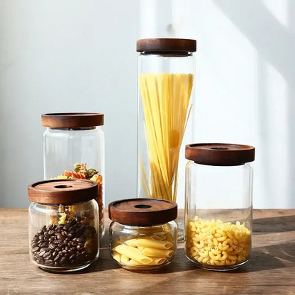 Modern glass hermetic storage jars with dark wood airtight lids kitchen