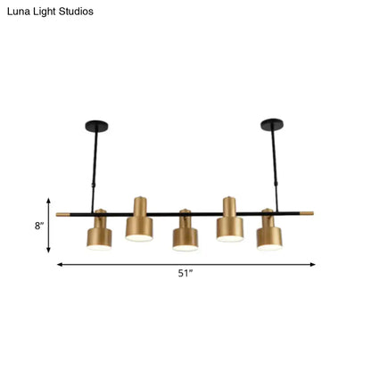 Modern gold and black drum pendant light for dining room island