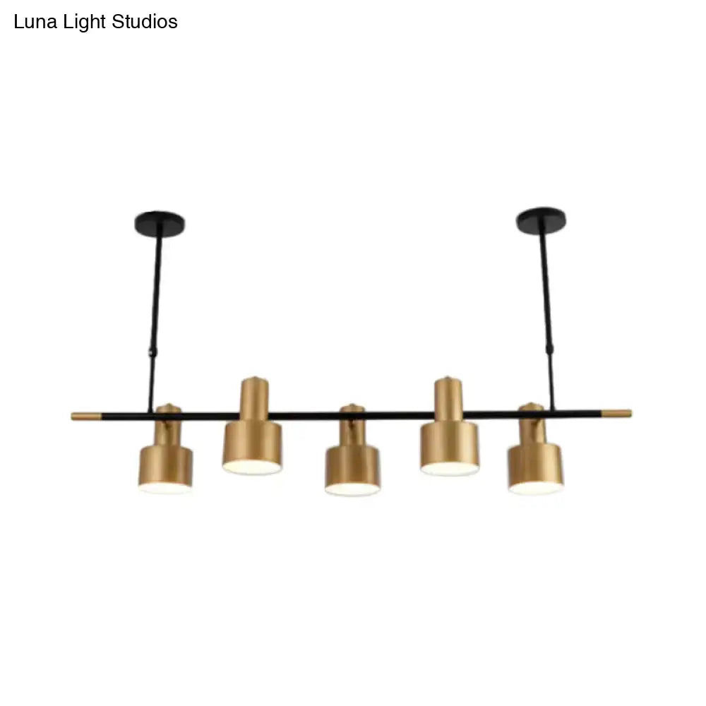 Modern gold and black drum pendant light for dining room island