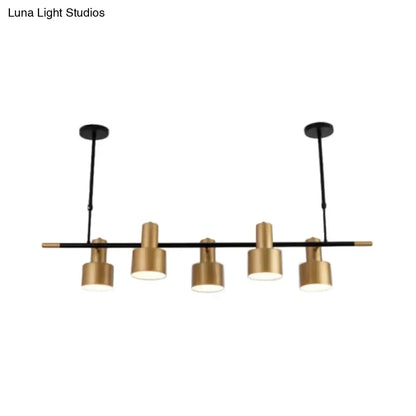Modern gold and black drum pendant light for dining room island