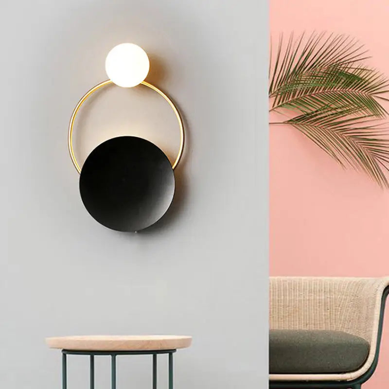 Modern gold and black orb wall lamp for living rooms