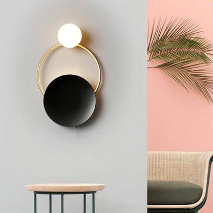 Modern gold and black orb wall lamp for living rooms