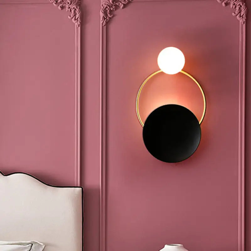 Modern gold and black orb wall lamp for living rooms