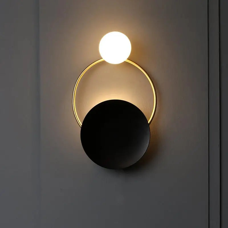 Modern gold and black orb wall lamp for living rooms