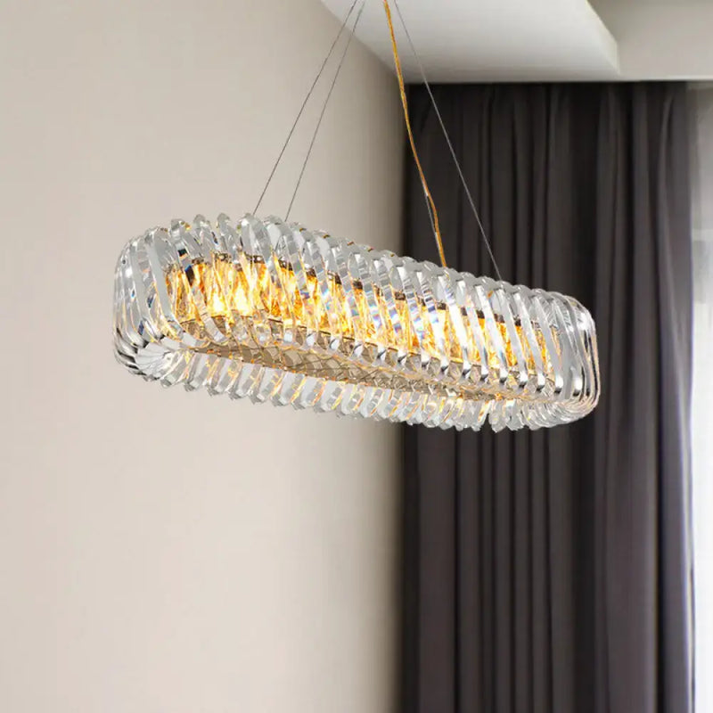 Modern gold and clear crystal oval pendant light for dining room