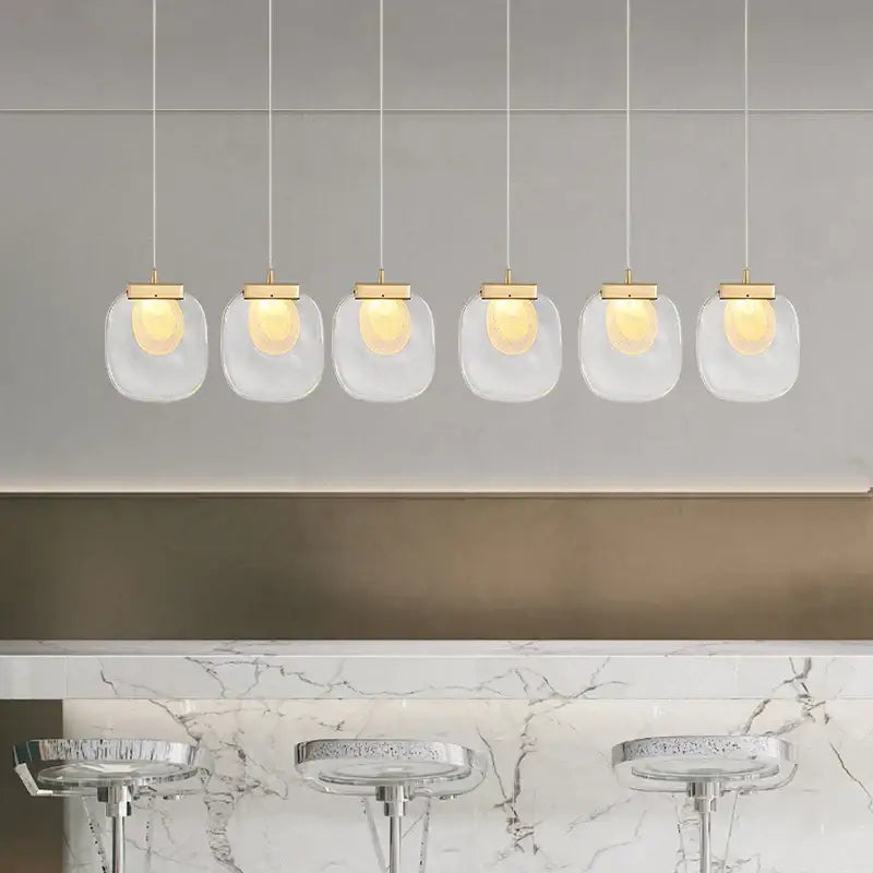Modern gold and glass pendant lights for dining room