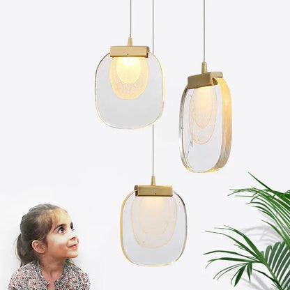 Modern gold and glass pendant lights for dining room