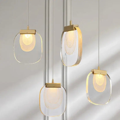 Modern gold and glass pendant lights for dining room