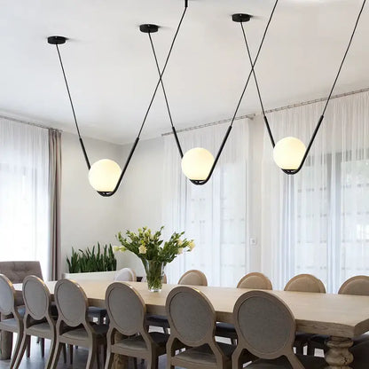 Modern gold & black pendant light dining room spherical glass trio