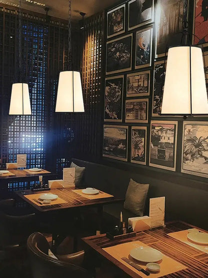 Modern gold & black pendant lights with fabric shades dining room